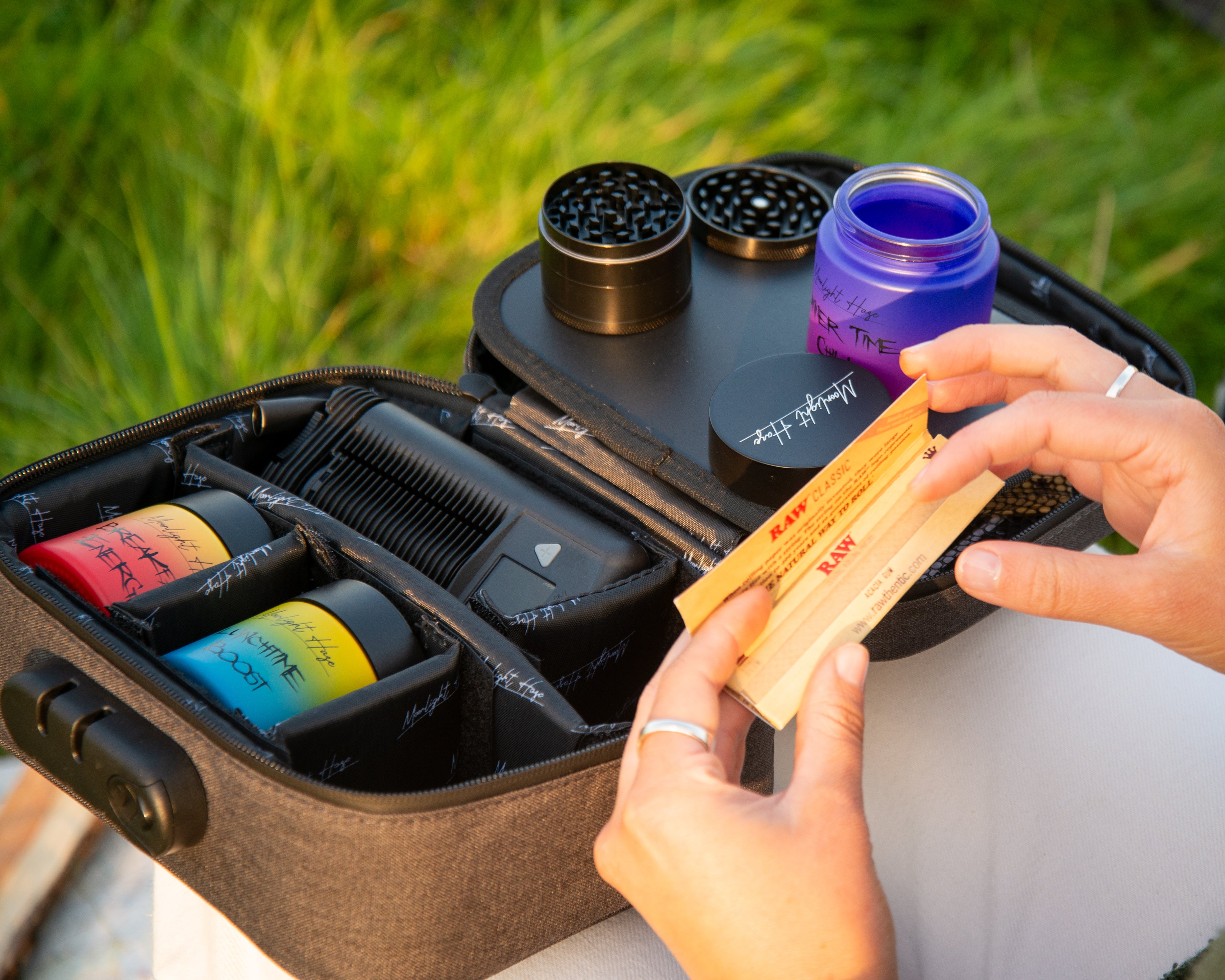 Smell-proof storage kit by Moonlight Haze with grinder and airtight jars in a lockable travel bag